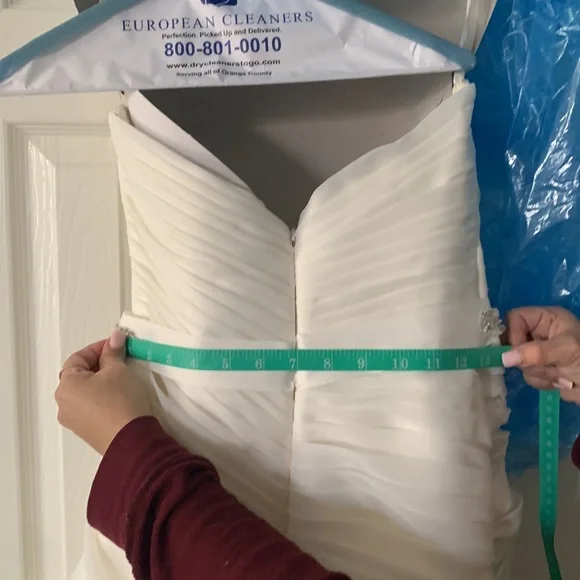 Beautiful off white Demtria cascading wedding dress.  Size 10, but altered. - Picture 12 of 12